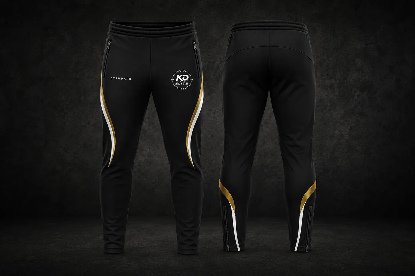 Black tapered training pants with gold and white curved panels and ankle zips, front and back views